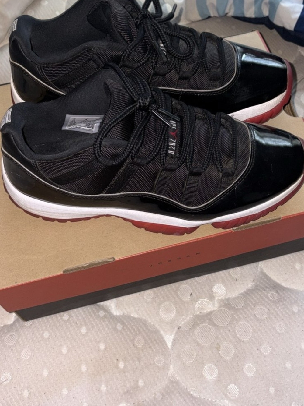 Black & Red Men’s Low-Top Jordan's 11 Athletic Sneakers